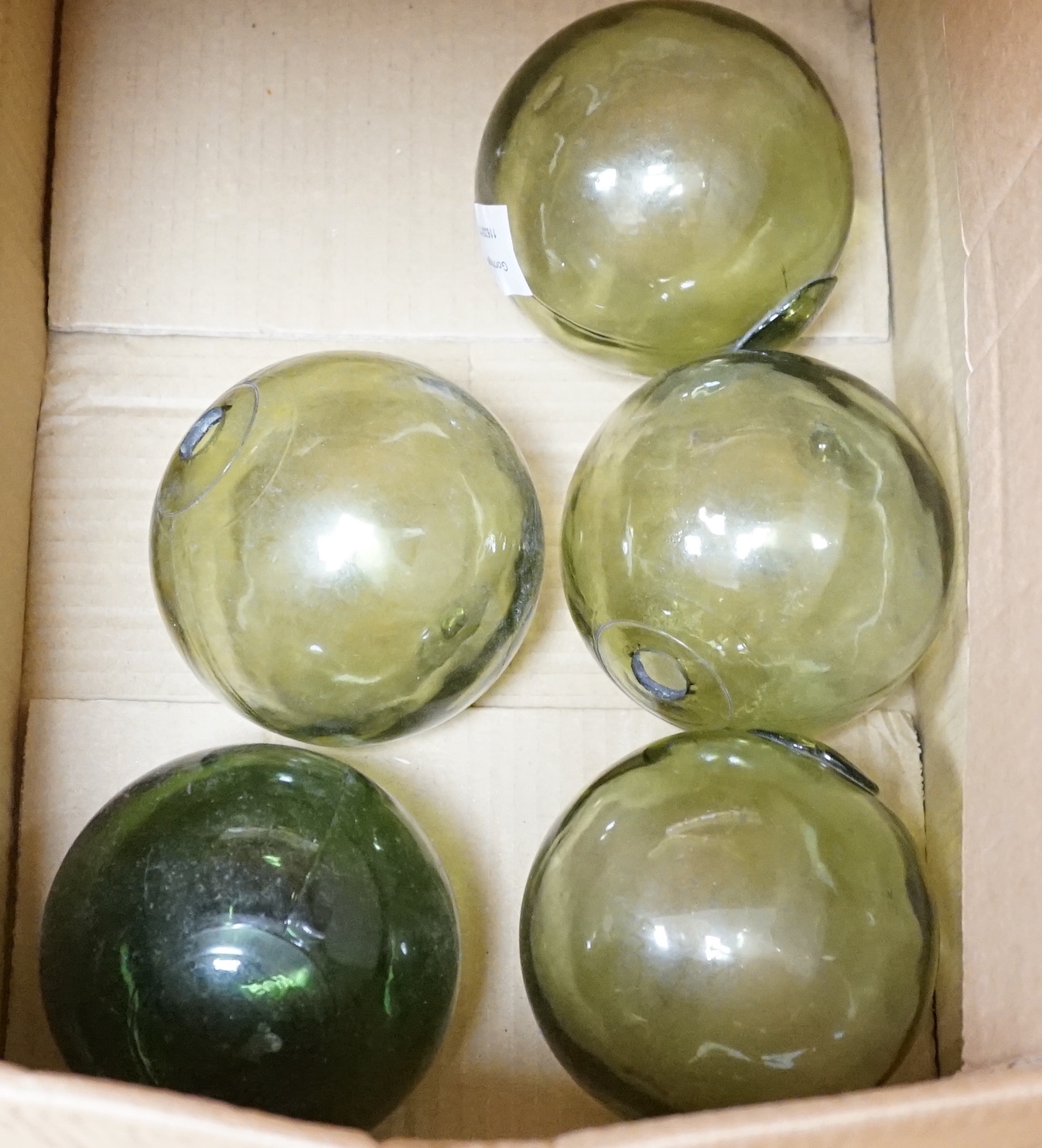A group of green glass fishermen’s balls